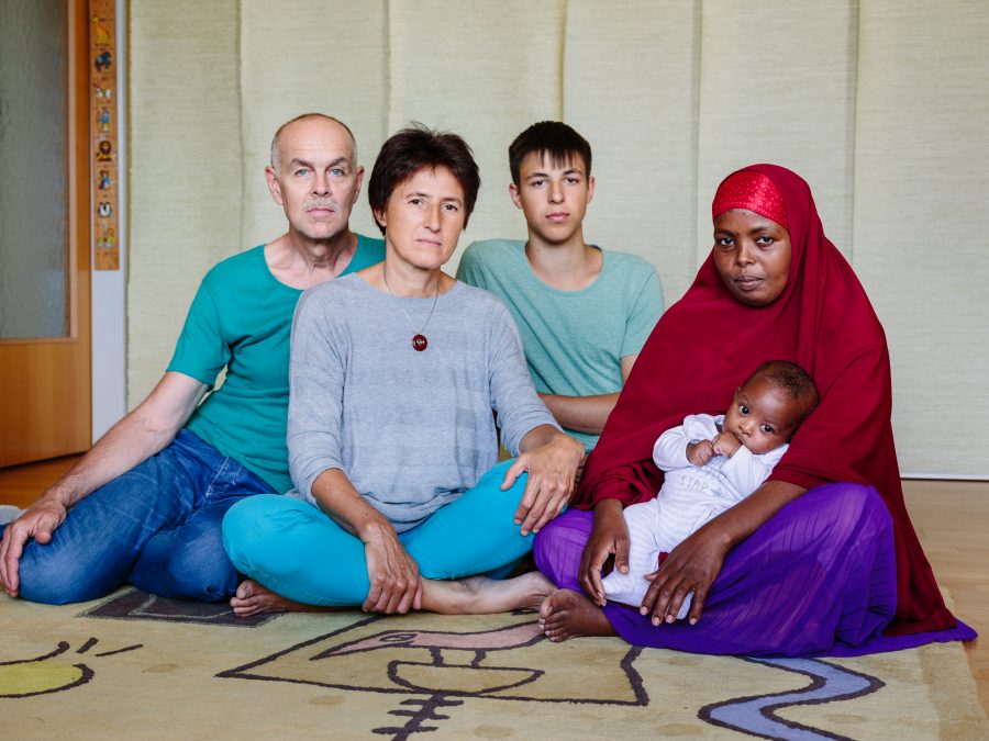 Austria. Marianne Grasl, Rolf Nagel and Leo Grasl (18) host Somali refugee Leyla Mahamud and her baby boy Zacharia who was born April 29, 2016, a few weeks after she moved in, in Vienna.