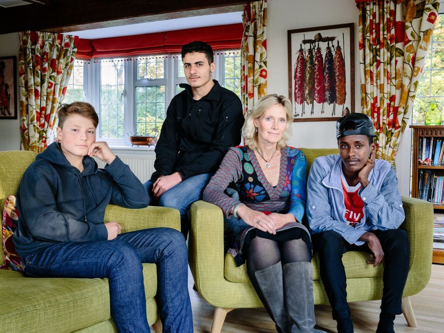 United Kingdom. Ingrid Van Loo Plowman and her son Ross host three refugees in their home in Epsom: Isak, 18, from Ethiopia, 19-year-old Abdul, from Syria and a 31-year-old engineer from the Middle East who declined to be identified for security reasons. Photo: Aubrey Wade / UNHCR